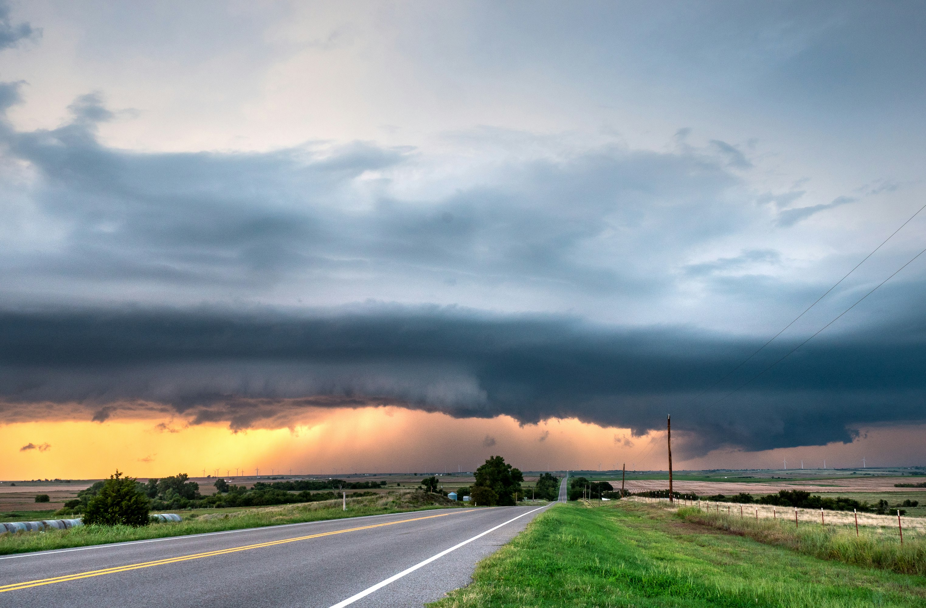 gray asphalt road under gray clouds